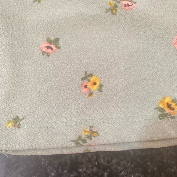 Women’s blue floral  mini skirt. It has a slit on the front. - Picture 2 of 2